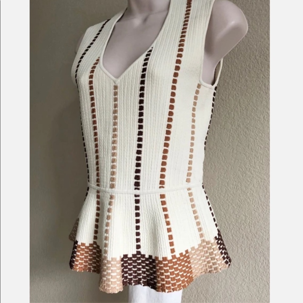 BCBG cream peplum top. NWOT.